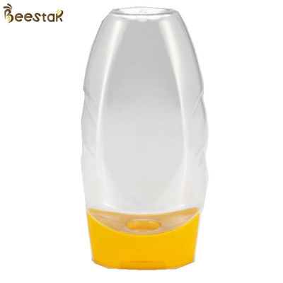 acheter Prix usine en plastique de catégorie comestible Honey Jar And Spoon de plastique spécial 335ml vide fabrication en ligne