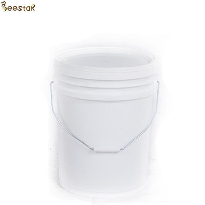 Réservoir de miel en plastique jaune blanc avec porte de miel pour le stockage du miel